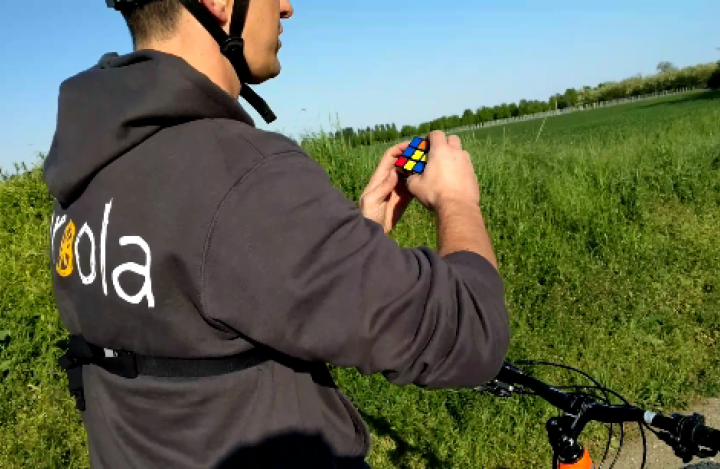 How to solve a rubik's cube riding a bike How to solve a rubik's cube riding a bike