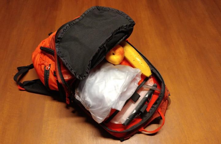 Backpack with food, water and rainsuit